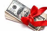 dollars with red ribbon isolated on white