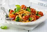 Rustic spaghetti with vegetables and fresh basil
