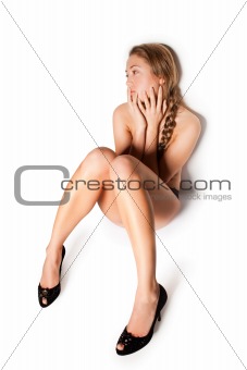 naked blonde  girl sitting on floor