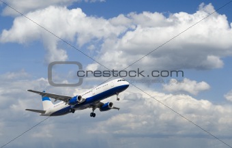 Airplane in Cloudy Sky