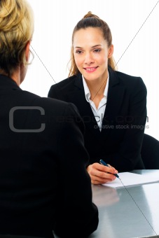 two women during a business meeting on white background studio