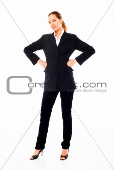 Young businesswoman standing with arms akimbo on white background studio