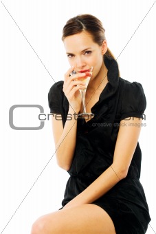 elegant young woman drinking a cocktail on white background studio