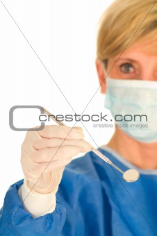 dentist holding dental mirror