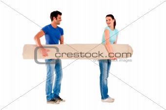 couple carrying a carpet