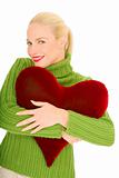 Woman with heart-shaped pillow