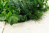 Fresh food dill and parsley on a wooden table