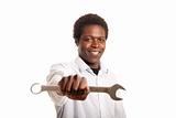 young black man holding wrench
