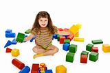Little girl playing with color cubes on floor