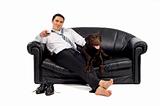 Young man relaxing on couch with his dog