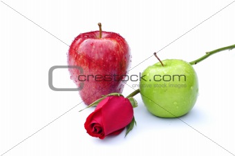 Red and green apples with rose in middle