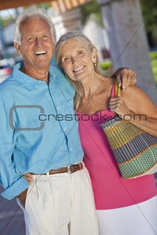 Happy Senior Couple Smiling Outside in Sunshine