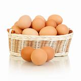 Eggs in basket isolated on white