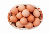Eggs in basket isolated on white