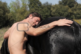 naked man and stallion