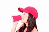 Cute brunette sipping of a can wearing a red hat
