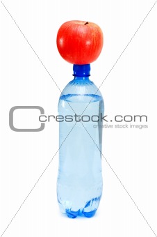 Health concept with bottle and apple on white