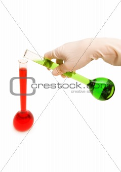 Hand in gloves holding tubes isolated on white