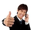 Young business Man With mobile phone and  Thumbs Up