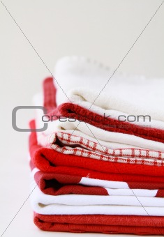 Pile of linen kitchen towels with space for your text