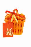 Mandarin oranges in gift backet and Chinese new year red packets