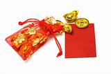 Gold ingots and coins in red sachet and red packet