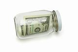 One US dollar in glass jar