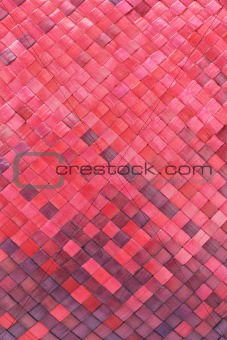 Red woven palm leaves mat