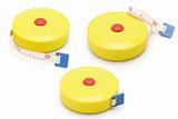 Three yellow plastic measuring tapes
