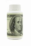 One hundred US dollars bill on plastic medicine bottle 
