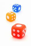 Three colorful rubber dice 