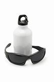 Metal water flask and sporty sunglasses 