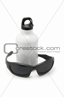 Metal water flask and sporty sunglasses 