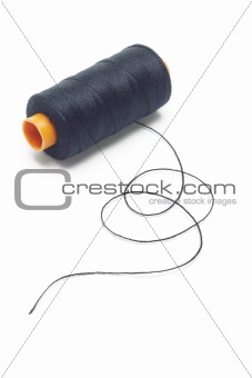 Bobbin of black cotton thread 