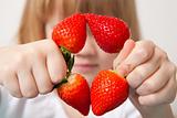 Little girl with strawberries