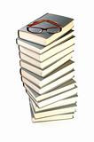 Stack of books and eyeglasses