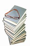 Stack of books and eyeglasses