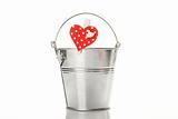 Metal bucket with a pin with a heart