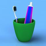 Toothbrush and gel toothpaste in  green cup
