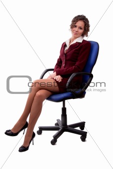 Business woman sitting on a chair.