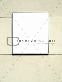 White plate in a metal frame