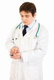Concentrated medical doctor using calculator
