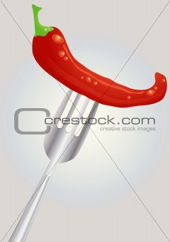 Fresh red hot chili pepper on a fork