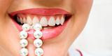 snow-white pearls of teeth