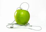 A green apple with headphones