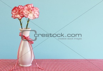 Red and White Carnations in a Vase