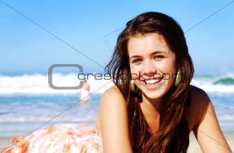 Young woman enjoying summer on the beach