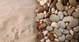 Colorful river stones on sand