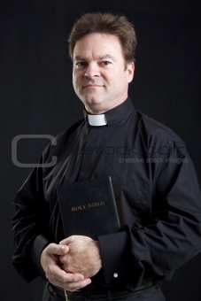Solemn Priest With Bible