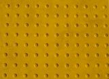 Grunge Yellow Texture of a Non-slip Pattern on a Sidewalk